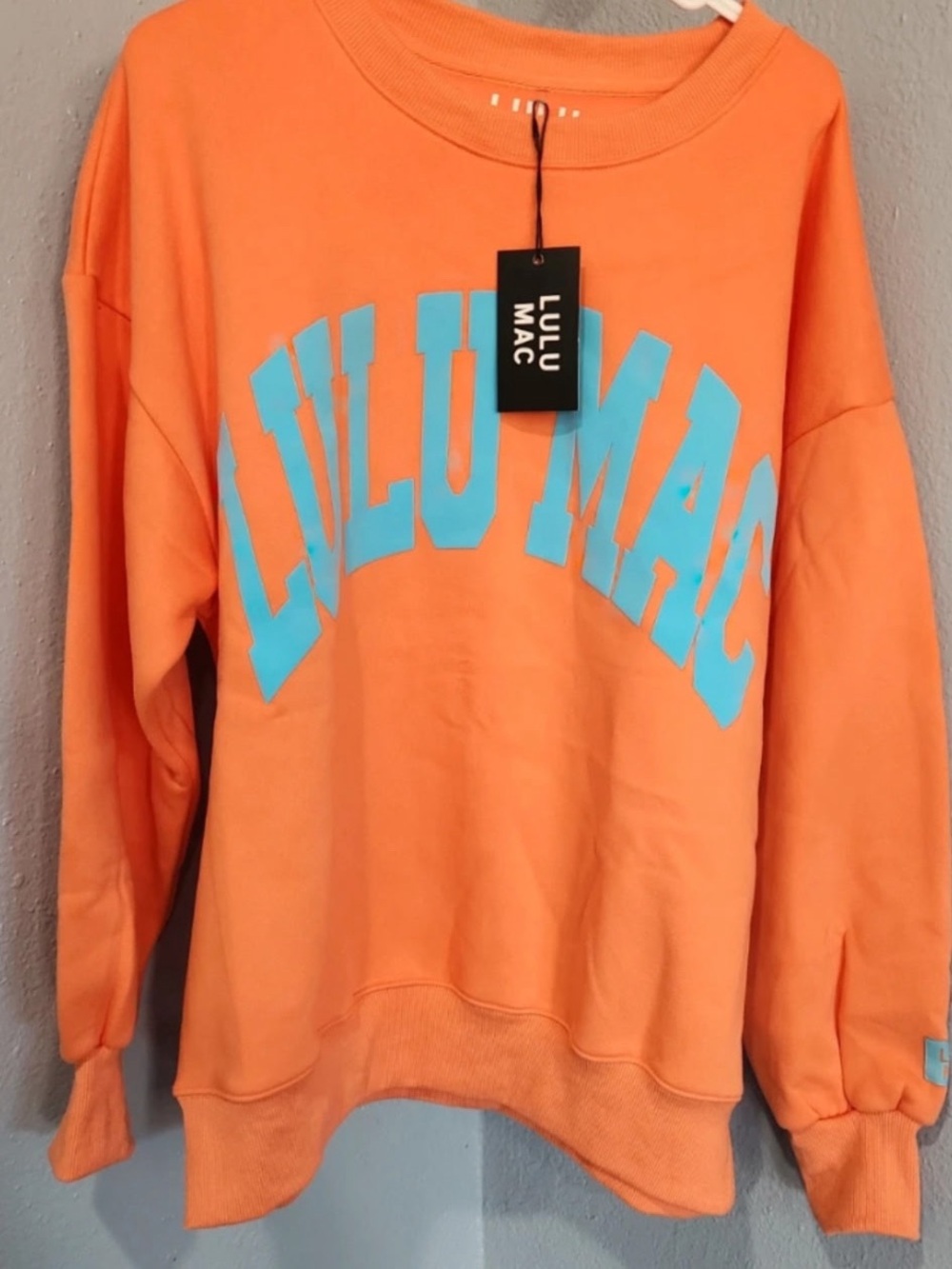 Women's Orange Crewneck Sweatshirt with Blue Logo
